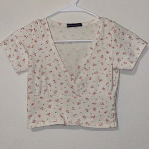 Brandy Melville. White and pink floral crop top